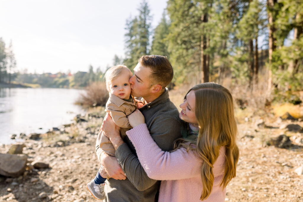 Parents comforting their child during a calm and supportive family photo session