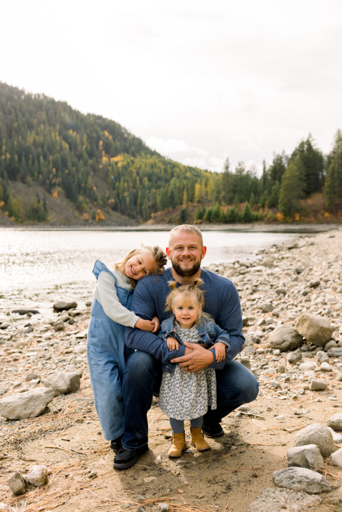 Family cuddling together naturally during a documentary-style photo session