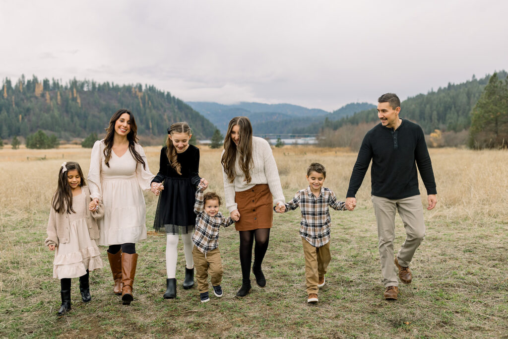 Family dressed in neutral tones during an outdoor family photography session in Northern Idaho
