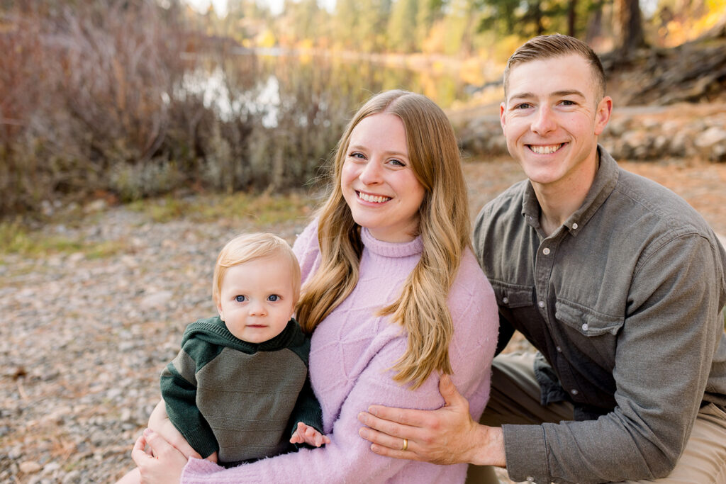 Family wearing layered clothing with natural textures during an outdoor portrait session