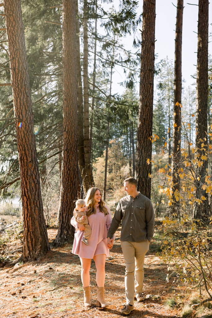 Shot of parent and child holding hands during a lifestyle family photography session in Idaho
